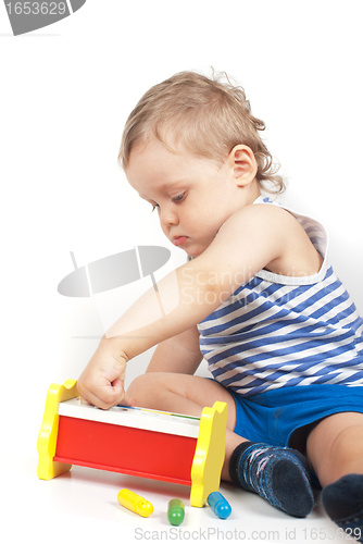 Image of boy with a toy