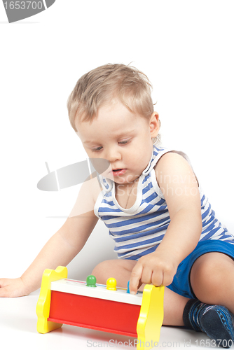 Image of boy with a toy