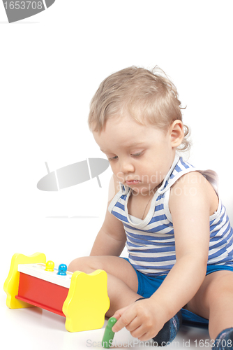 Image of boy with a toy