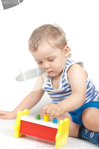 Image of boy with a toy