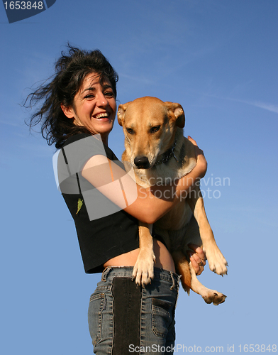 Image of woman and mix dog