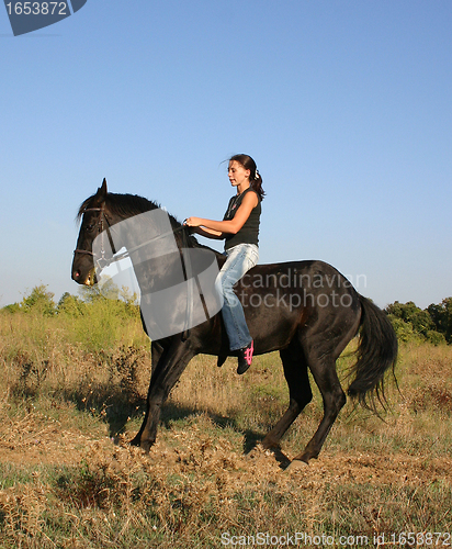 Image of young woman and horse