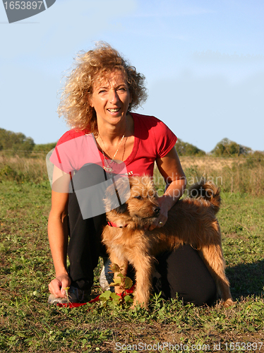 Image of Pyrenean sheepdog and woman