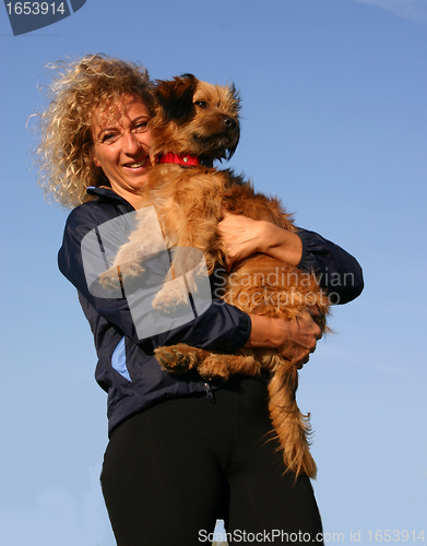 Image of Pyrenean sheepdog and woman