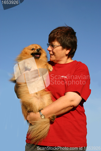 Image of pomeranian and woman