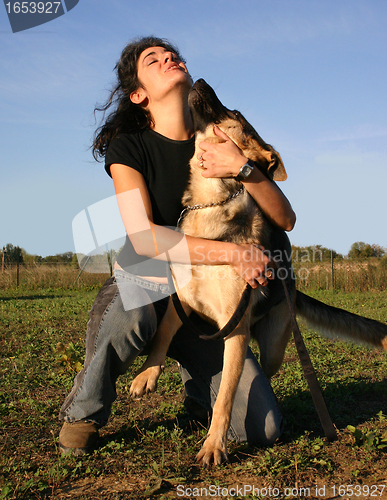Image of german shepherd and  girl