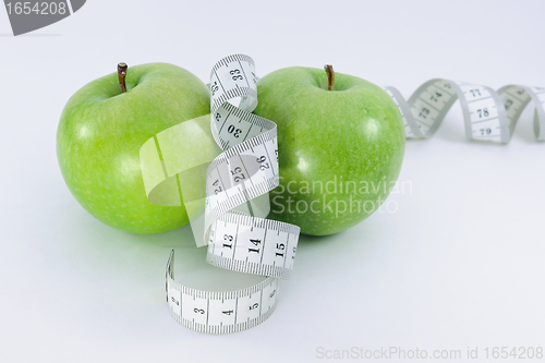 Image of Apples with  measurement tape