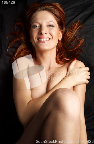 Image of redhead on black