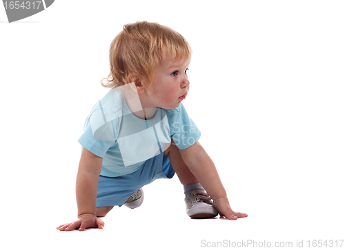 Image of A little boy on all fours