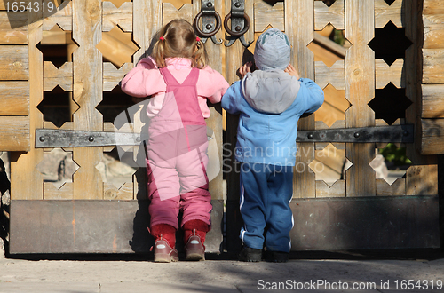 Image of Children near the wooden gates
