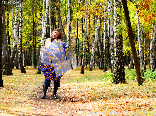 Image of Women with umbrella in a park
