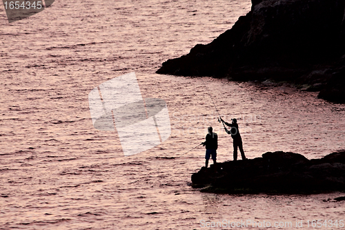 Image of Two men fishing