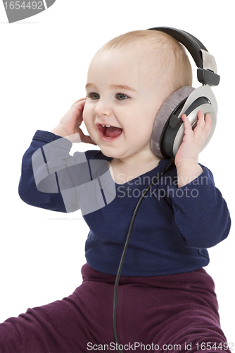 Image of young child with ear-phones listening to music