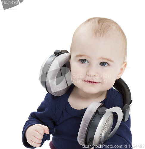 Image of young child with ear-phones listening to music