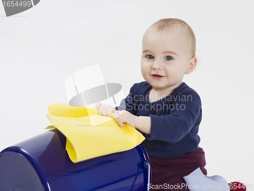 Image of toddler with bucket and floor cloth