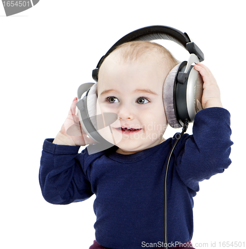 Image of young child with ear-phones listening to music