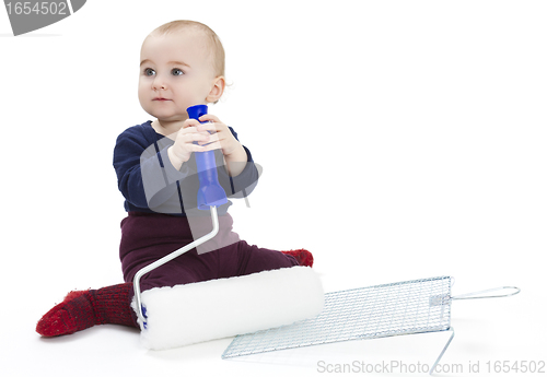 Image of young child with painters equipment