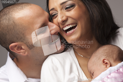 Image of Mixed Race Young Family with Newborn Baby