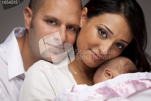 Image of Mixed Race Young Family with Newborn Baby