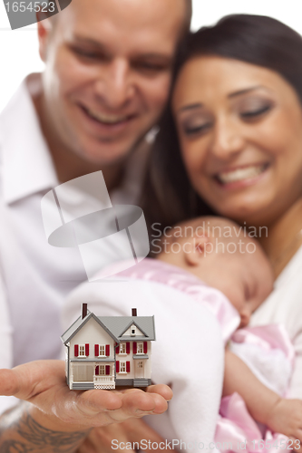 Image of Mixed Race Family with Small Model House