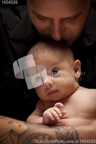 Image of Young Father Holding His Mixed Race Newborn Baby