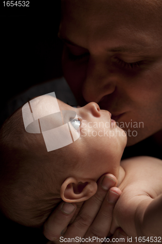 Image of Young Father Holding His Mixed Race Newborn Baby