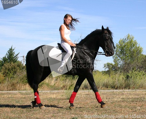 Image of young woman and horse