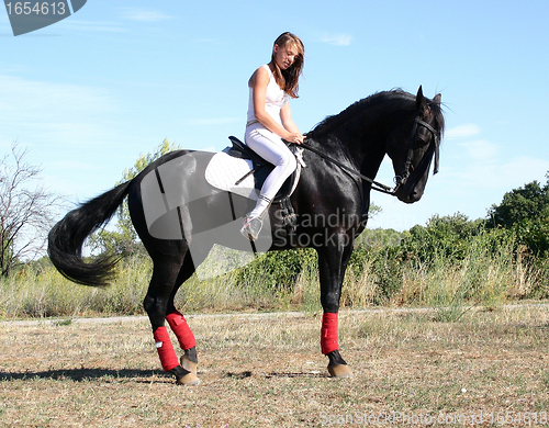 Image of young woman and horse