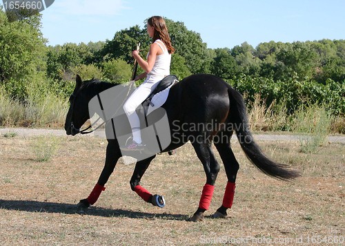 Image of young woman and horse