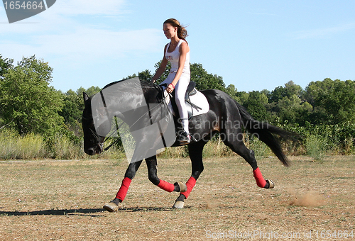 Image of young woman and horse