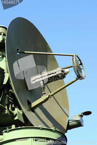 Image of army radar against blue sky 