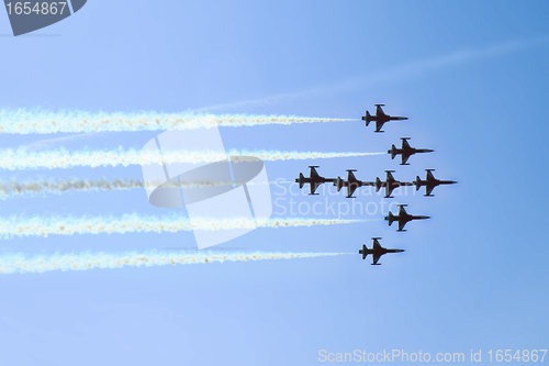 Image of aircrafts on the blue sky in the air show