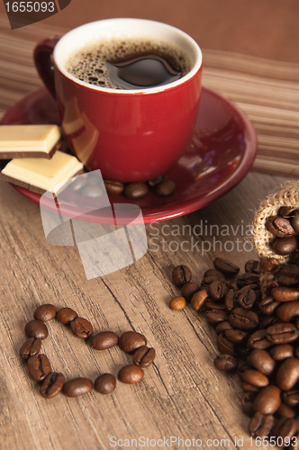 Image of Grains of coffee on a wooden surface