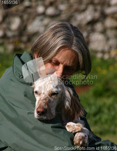 Image of senior woman and english setter