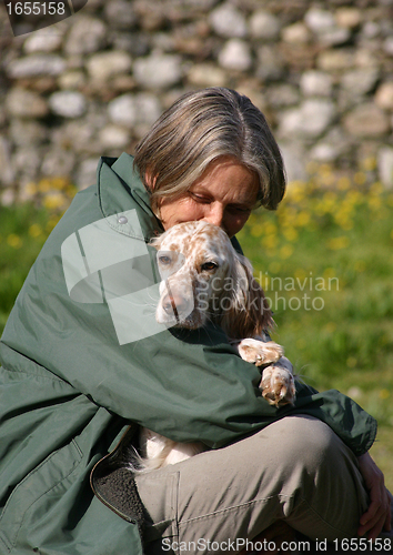 Image of senior woman and english setter