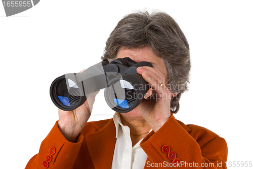 Image of Female senior business woman with binoculars