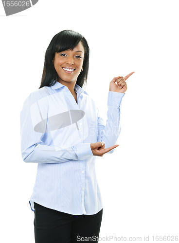 Image of Smiling young woman pointing