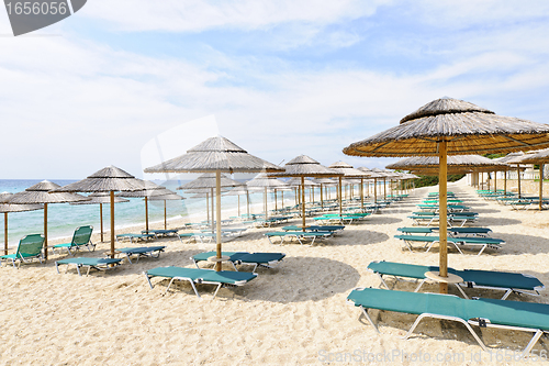 Image of Beach umbrellas on sandy seashore