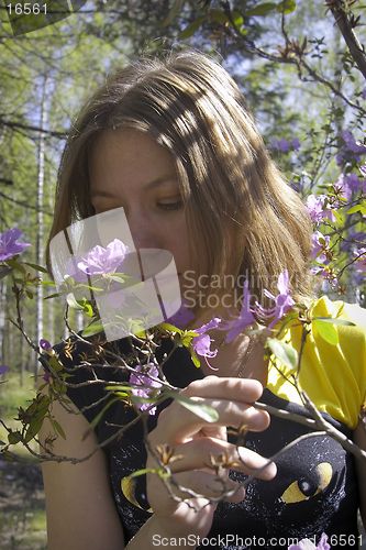 Image of Young woman and flowers