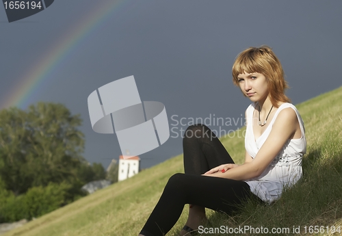 Image of Attractive girl and rainbow