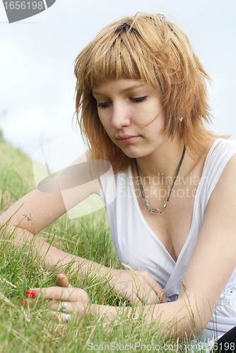 Image of Woman lying on grass