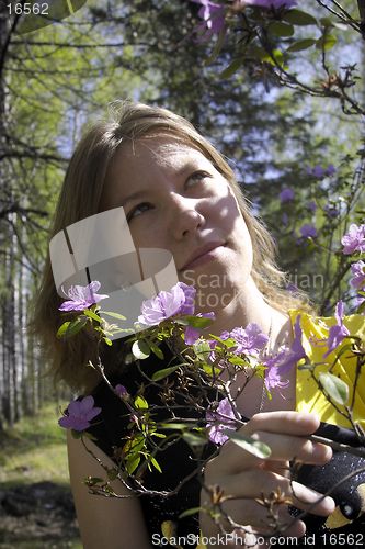 Image of Young woman and flowers