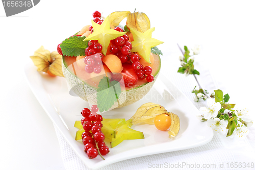 Image of Fresh fruits served in melon bowl