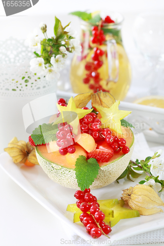 Image of Fresh fruits served in melon bowl