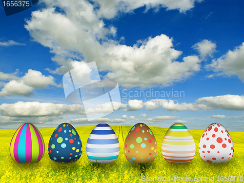 Image of many color easter eggs over blue sky background 
