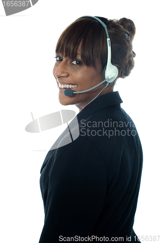 Image of Portrait of executive female in headsets