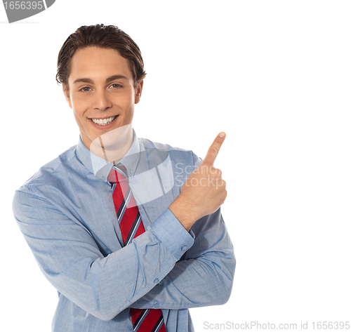 Image of Business male pointing upwards