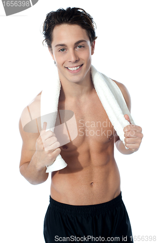 Image of Handsome muscular man with the towel