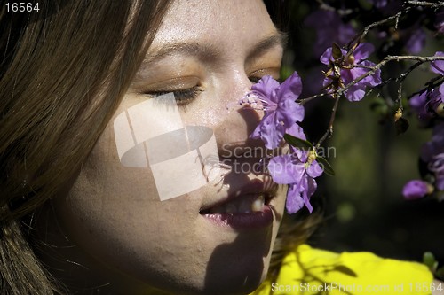 Image of Young woman and flowers