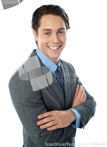 Image of Charming young businessman posing in style